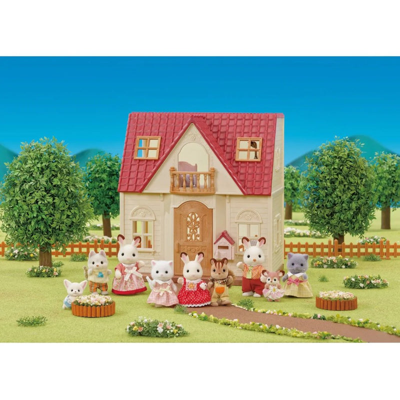 Red roof cozy cottage dollhouse with animal figurines in garden setting