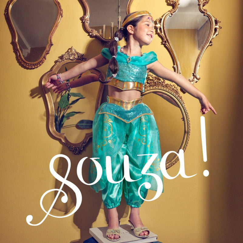 Child wearing turquoise Amira genie costume with decorative mirrors and ornate background
