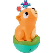 Orange capybara roly poly toy with bird on top and green base
