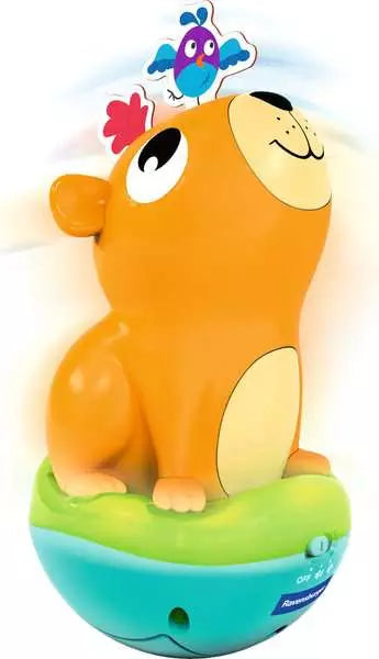 Orange capybara roly poly toy with blue bird on top against white background