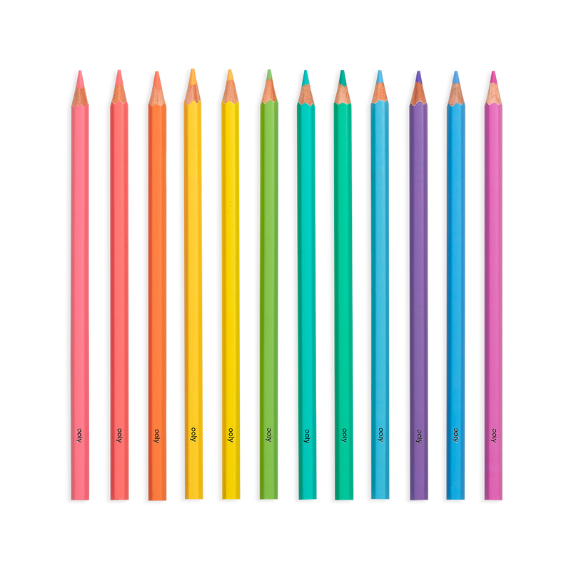 Colorful double-ended colored pencils arranged in spectrum order on white background