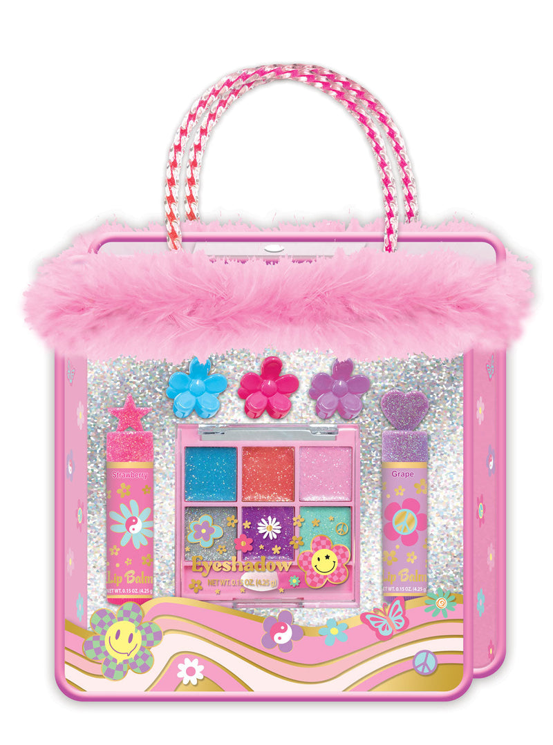 Pink beauty bag with fur trim, handles, and makeup palette inside