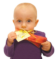 Baby holding and chewing on colorful crinkly Baby Paper toy with yellow ribbon