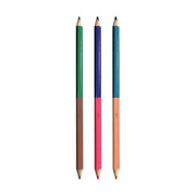 Three double-ended colored pencils with different color combinations on black background
