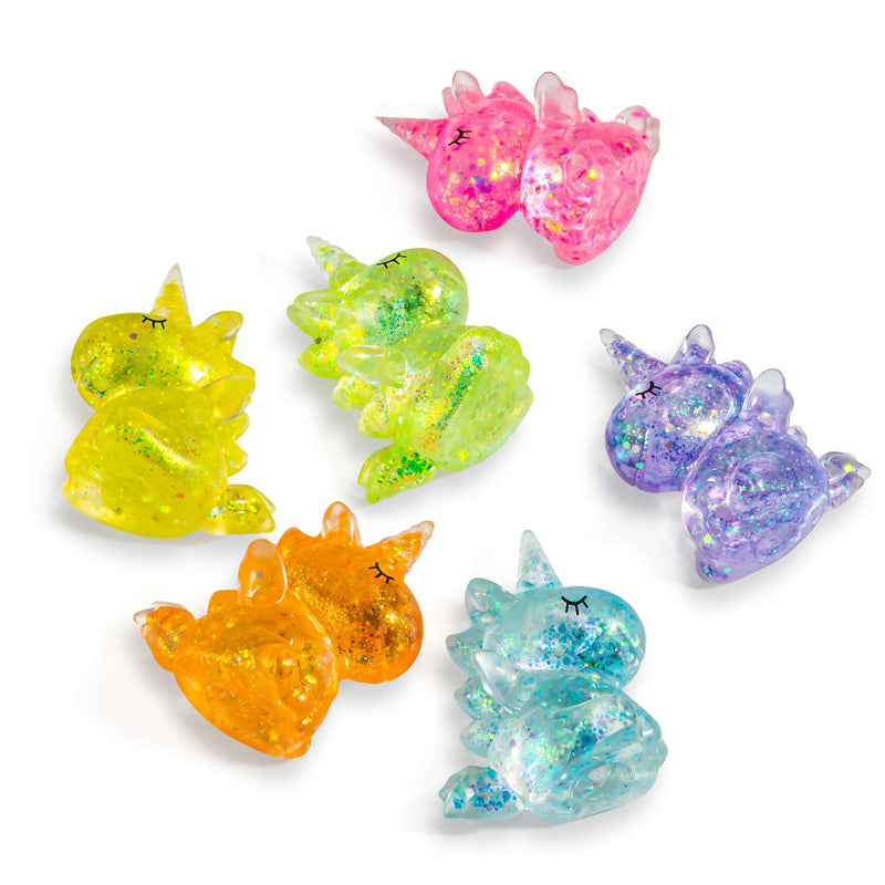 Six glittery unicorn-shaped squishy toys in pink, yellow, green, orange, purple, and blue