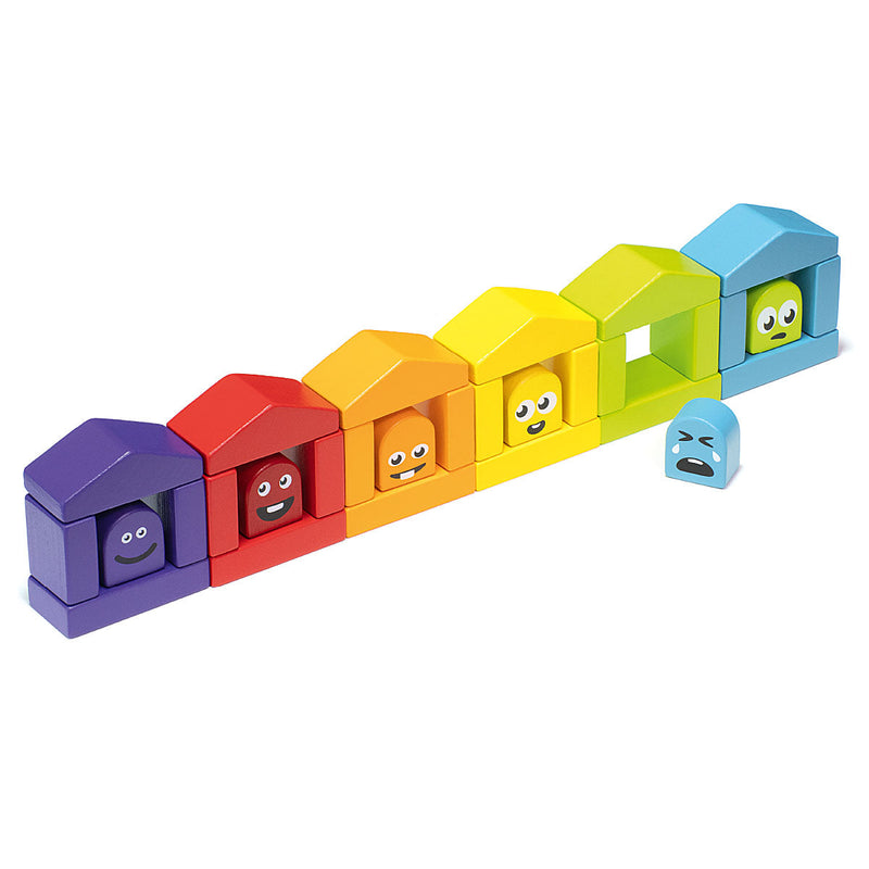 Colorful rainbow wooden block houses with cute faces in construction set toy