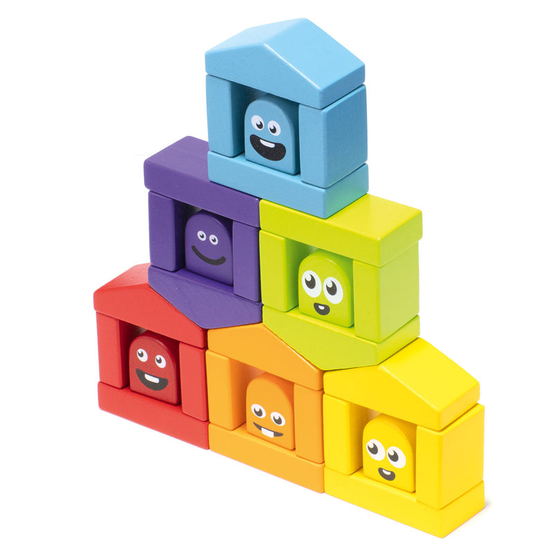 Colorful wooden construction blocks with cute faces arranged in pyramid formation