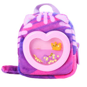 Purple tie-dye plush backpack with heart-shaped window containing small toy and star confetti