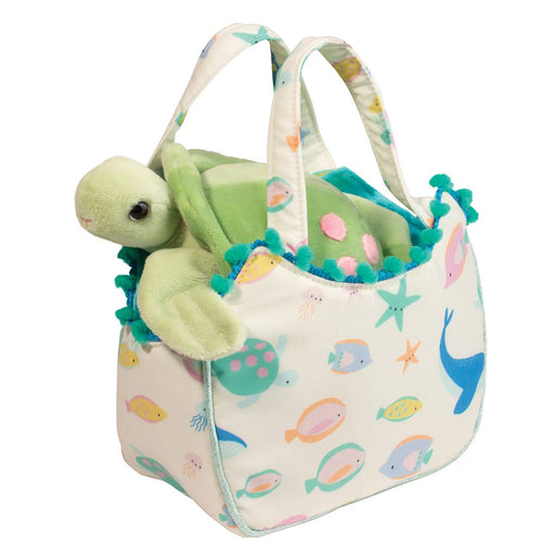 Ocean themed fabric tote bag with green sea turtle plush toy and decorative pom-poms