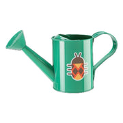 Green metal watering can with decorative pineapple design on white background