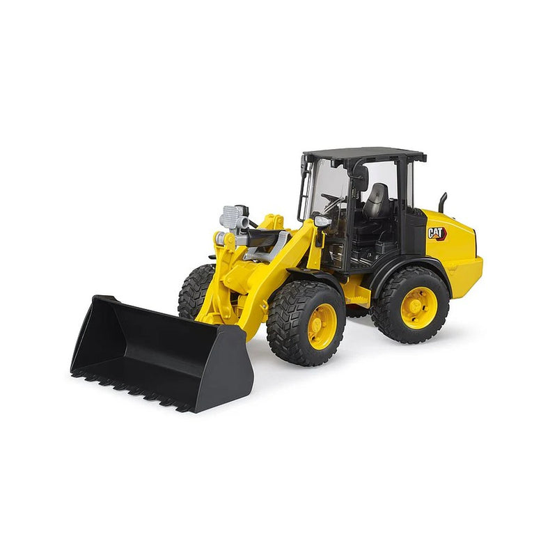 Yellow CAT wheel loader toy with black bucket on white background