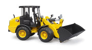 Yellow CAT wheel loader toy with black bucket on white background