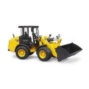 Yellow CAT wheel loader toy with black bucket on white background