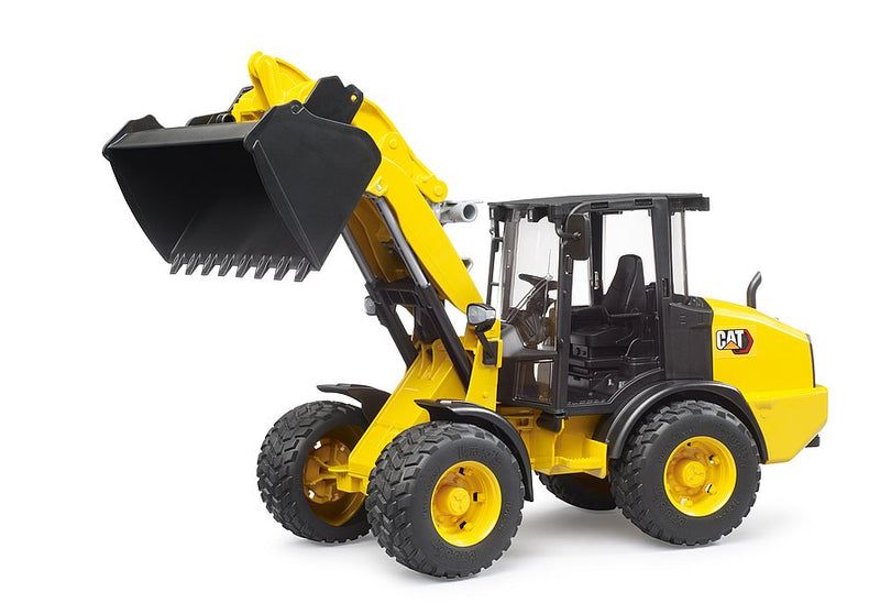 Yellow and black CAT wheel loader toy with bucket raised on white background