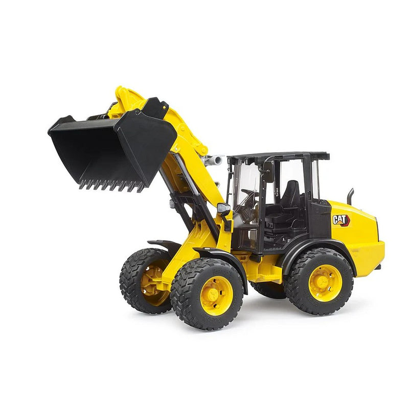 Yellow and black CAT wheel loader toy with bucket raised on white background