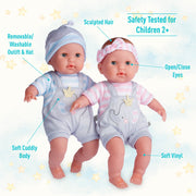 Two Berenguer 15 inch twin baby dolls with labeled features on starry background