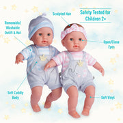 Two Berenguer 15 inch twin baby dolls with labeled features on starry background
