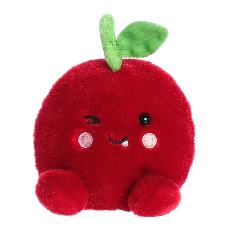 Red plush cherry toy with cute face, green leaf, and small arms