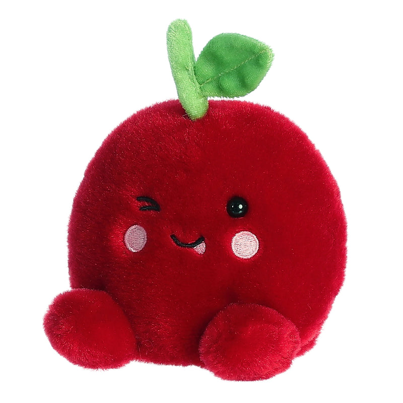 Red plush cherry toy with cute face, green leaf stem, and small feet