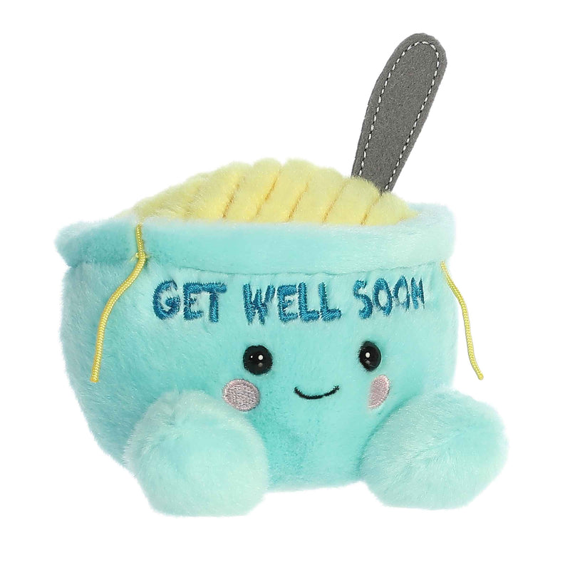 Turquoise plush chicken soup bowl toy with embroidered 'GET WELL SOON' text and gray spoon