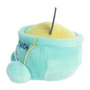 Turquoise plush slipper shaped like chicken soup bowl with yellow interior and black wick