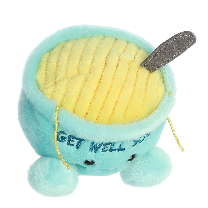 Aurora Palm Pal Welly chicken soup plush toy with turquoise bowl and yellow contents