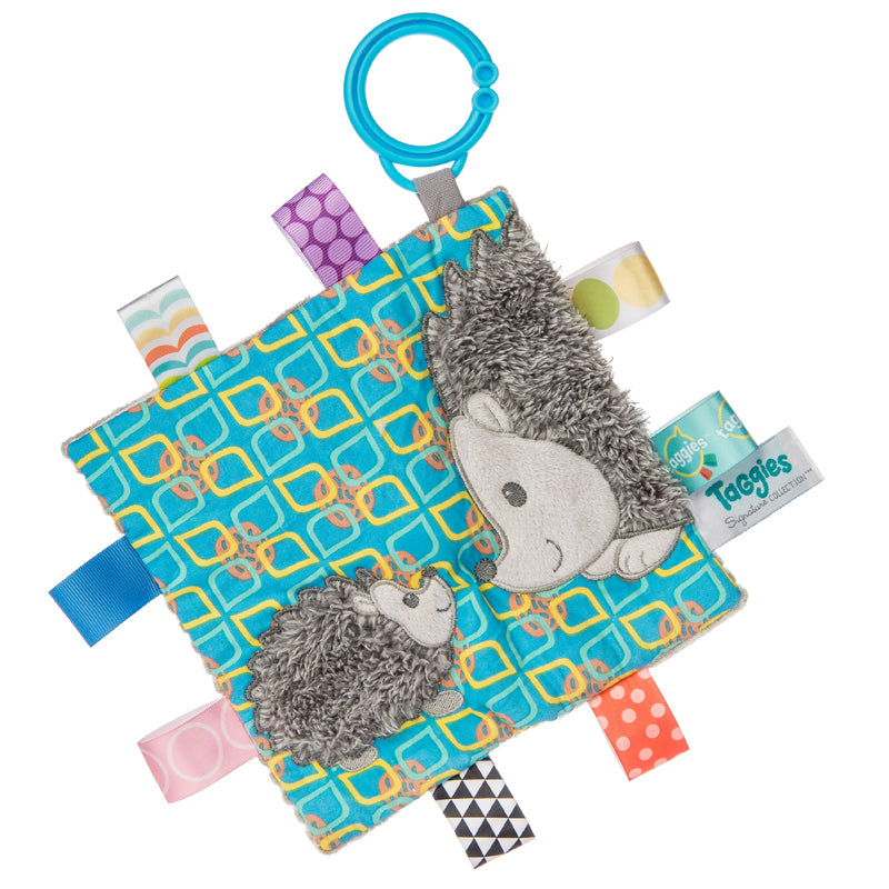 Taggies Crinkle Me Heather Hedgehog sensory toy with colorful tags and blue teething ring