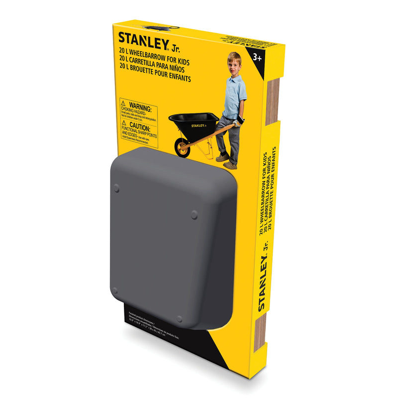 Stanley Jr. kids wheelbarrow in packaging with black wheelbarrow visible