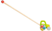 Goki wooden push along tractor toy with long handle and red ball grip
