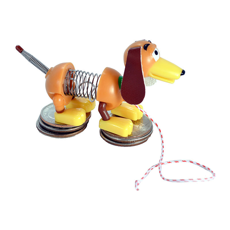 Orange Slinky Dog pull toy with spring body and red-white striped string