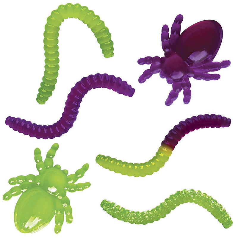 Colorful gummy candy shapes including worms and spiders in green and purple