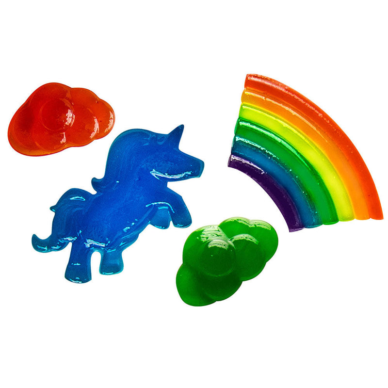 Colorful gummy candy shapes including rainbow, unicorn, sun and cloud on white background