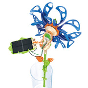 Solar-powered flower toy with blue petals, green stem, and solar panel in clear vase