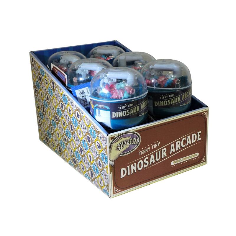 Display box containing six dome-shaped Teeny Tiny Dinosaur Arcade toys with colorful contents inside