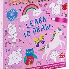 Pink spiral-bound Learn to Draw activity book with unicorn and rainbow illustrations