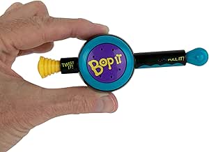 Hand holding World's Smallest Bop It electronic game showing colorful buttons and Bop It branding