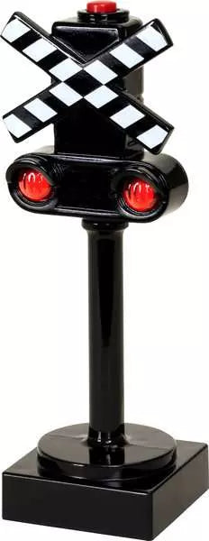 Black toy railroad crossing signal with checkered crossing arms and red lights