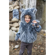 Child wearing gray furry wolf costume vest with hood and paw gloves outdoors