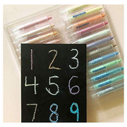 Wonder Stix 24 pack colorful crayons with black paper showing dotted numbers demonstration