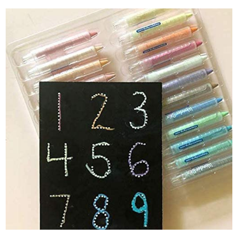 Wonder Stix 24 pack colorful crayons with black paper showing dotted numbers demonstration