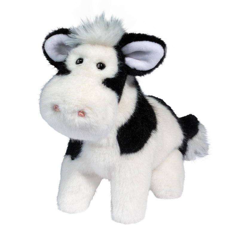 Plush black and white cow stuffed animal with fuzzy hair tuft