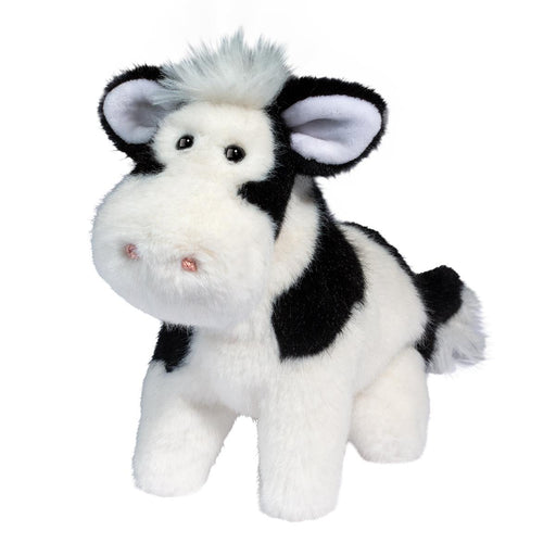 Plush black and white cow stuffed animal with fuzzy hair tuft