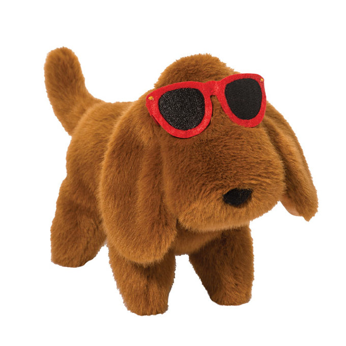 Brown plush dachshund dog toy wearing red sunglasses on white background