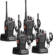 Four black walkie-talkie radios with antennas and charging bases on white background
