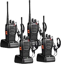 Four black walkie-talkie radios with antennas and charging bases on white background