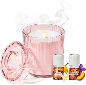 Pink ribbed glass flameless candle diffuser with lid and essential oil bottles