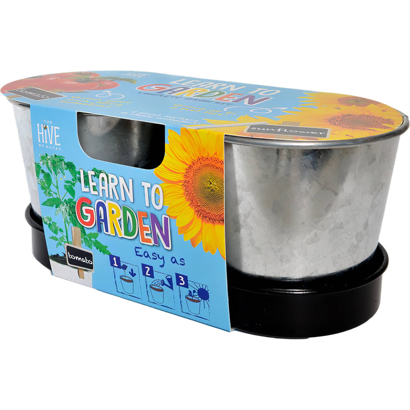 Learn to Garden grow kit with clear containers and colorful packaging showing sunflower and tomato