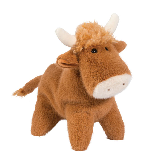 Brown plush Highland cow stuffed animal with horns and fluffy fur on white background