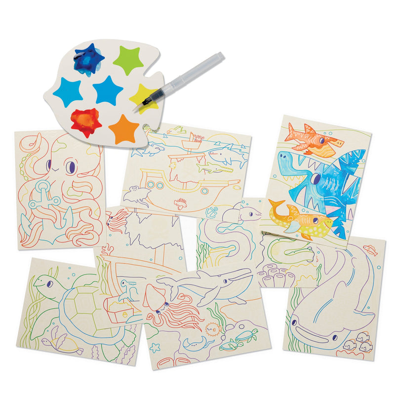 Magic watercolor painting set with palette, brush and ocean-themed coloring pages