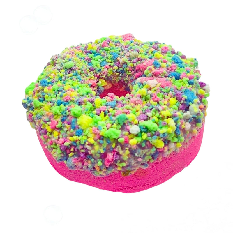 Colorful donut-shaped bath bomb with multicolor sprinkles and pink base on white background